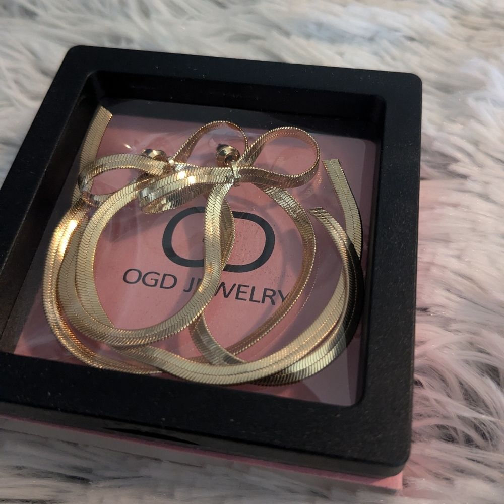 Long Bow Gold Earrings
